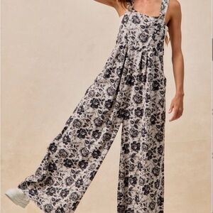 BiBi Black and Cream Floral Jumpsuit. New without tags.